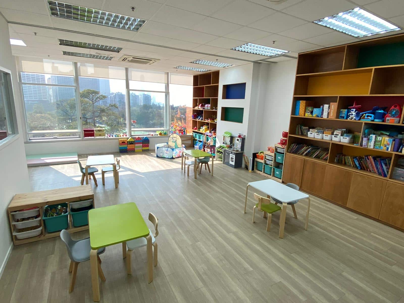 A lively playroom showcasing an array of toys and comfortable furniture, perfect for imaginative play and creativity.